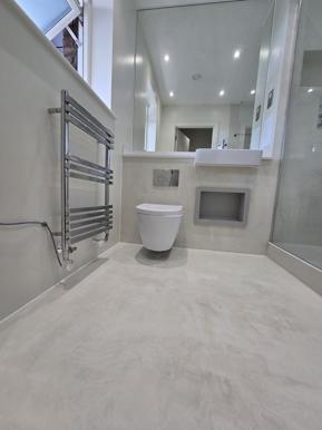 Completed Revivio bathroom renovation with a walk-in shower, recessed niche and large-format tiling