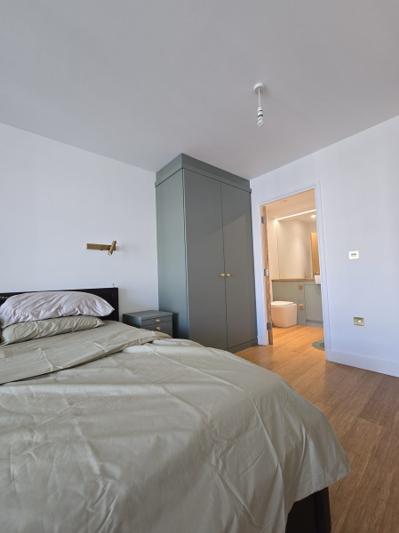 Dalston bedroom with view through to the renovated en-suite