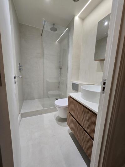 Marylebone second bathroom with wood slat panelling and round countertop basin