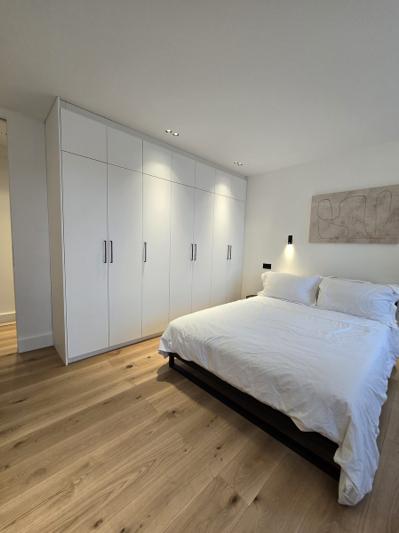 Marylebone bedroom with skylight and built-in wardrobe