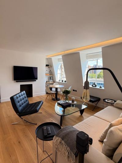 Marylebone living room second wide view with fireplace and dining nook