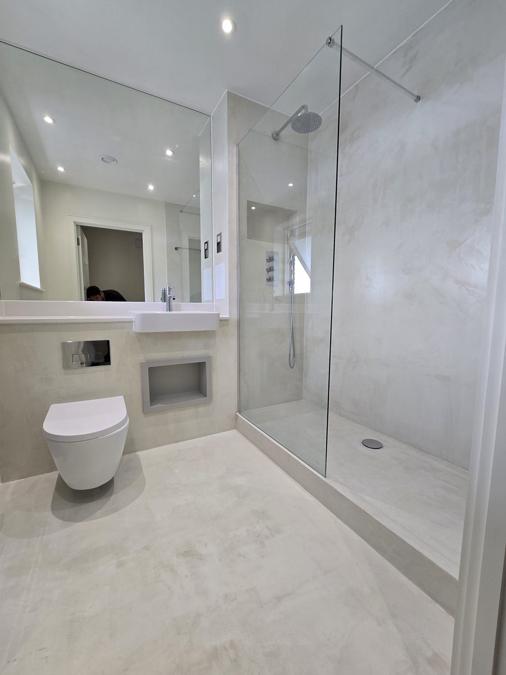Second view of the Bermondsey bathroom showing the vanity, mirror and heated towel rail