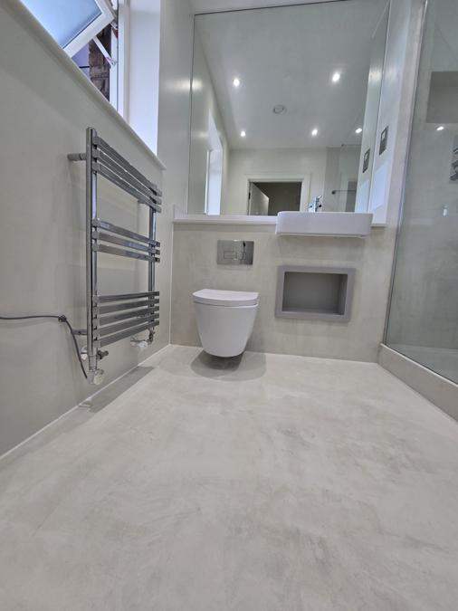 Bermondsey bathroom renovation with microcement walls and floor, chrome fittings and floating vanity