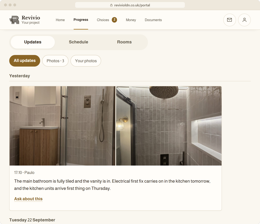 An update in the Revivio client portal: two photos of a newly tiled bathroom from site, a note from the project manager and a link to ask about it
