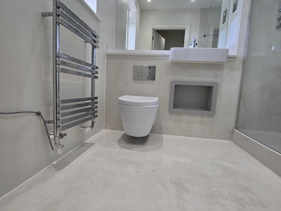 Bermondsey bathroom renovation with microcement walls and floor, chrome fittings and floating vanity