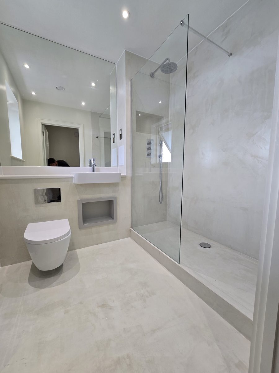 Bermondsey bathroom second angle showing walk-in shower with microcement finish