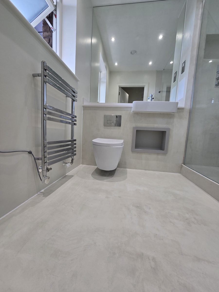 Bermondsey bathroom renovation with microcement walls and floor, chrome fittings and floating vanity