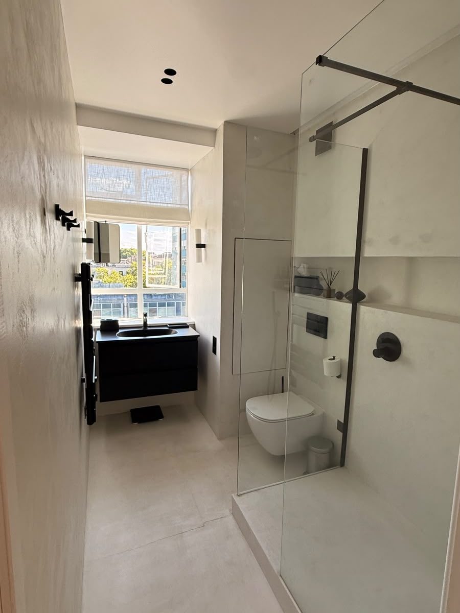 Marylebone bathroom second angle showing glass shower screen and vanity