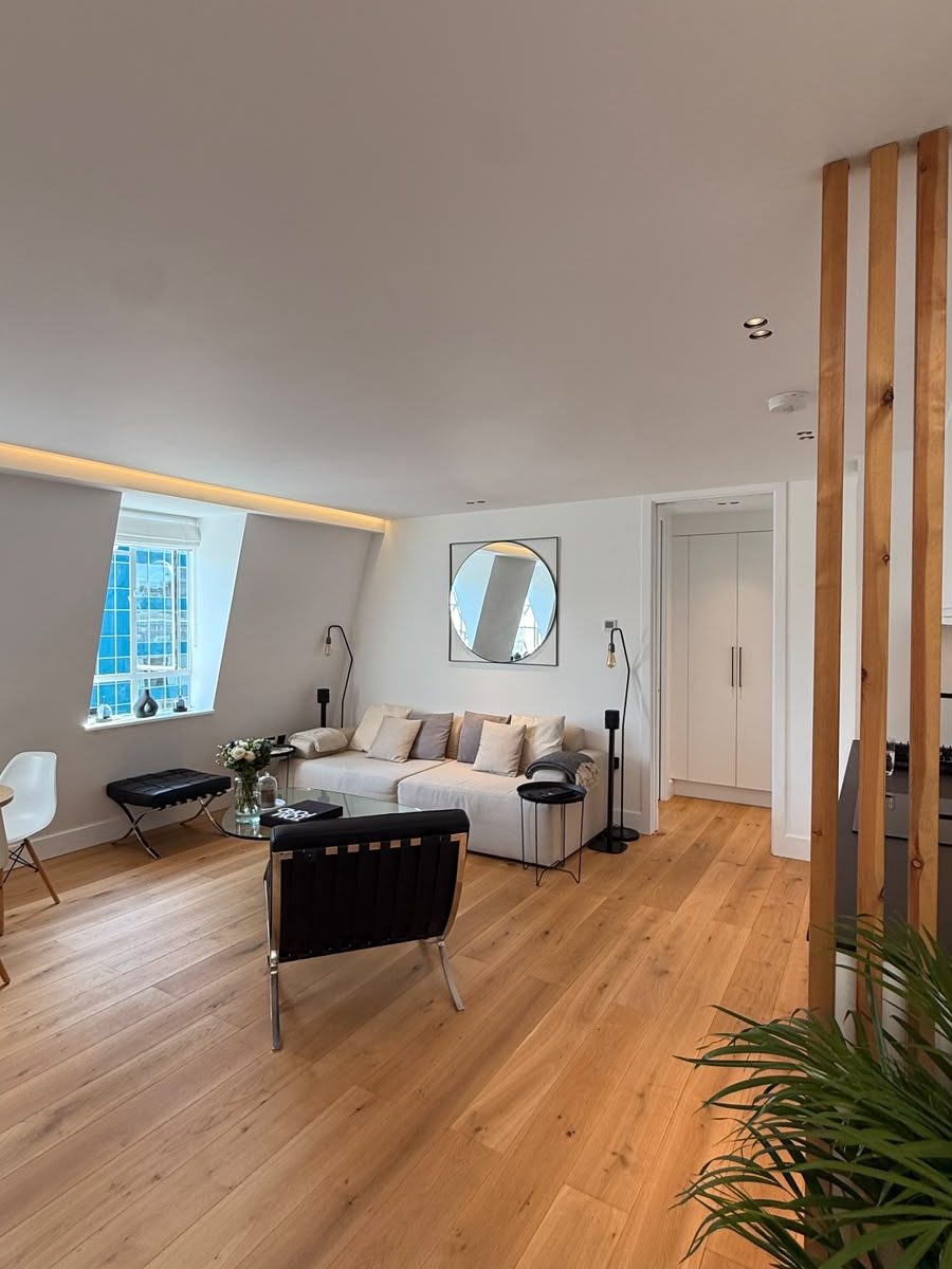 Marylebone living room wide view with sofa and dining nook